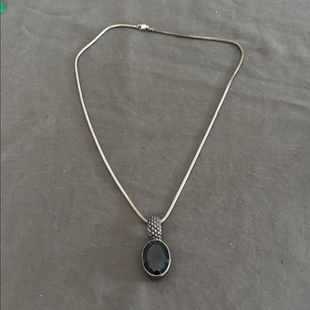 Silver chain and pendant with set stone.